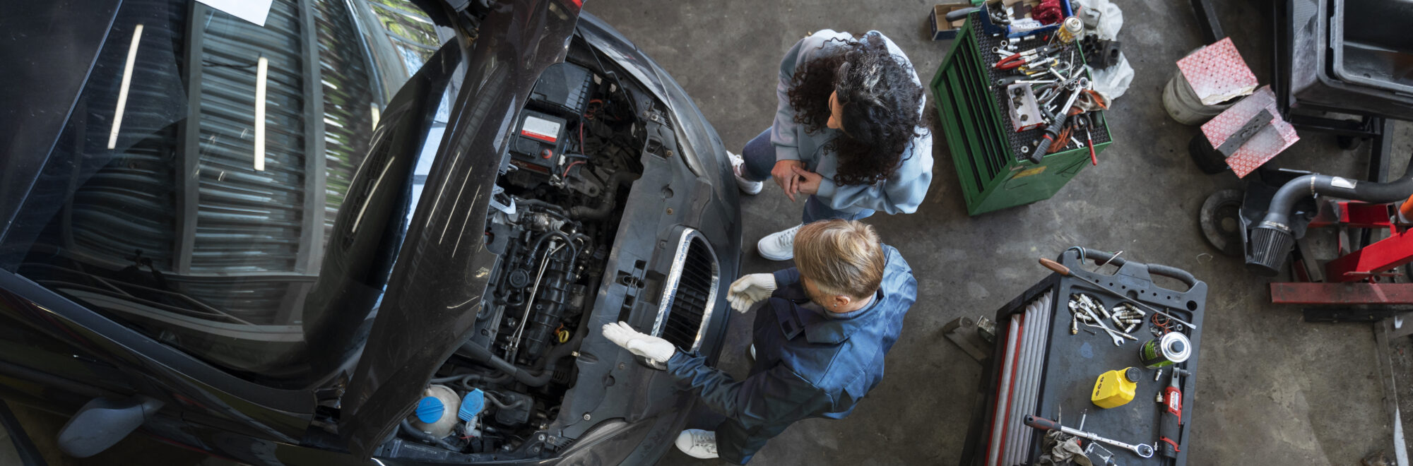 top-view-man-repairing-car